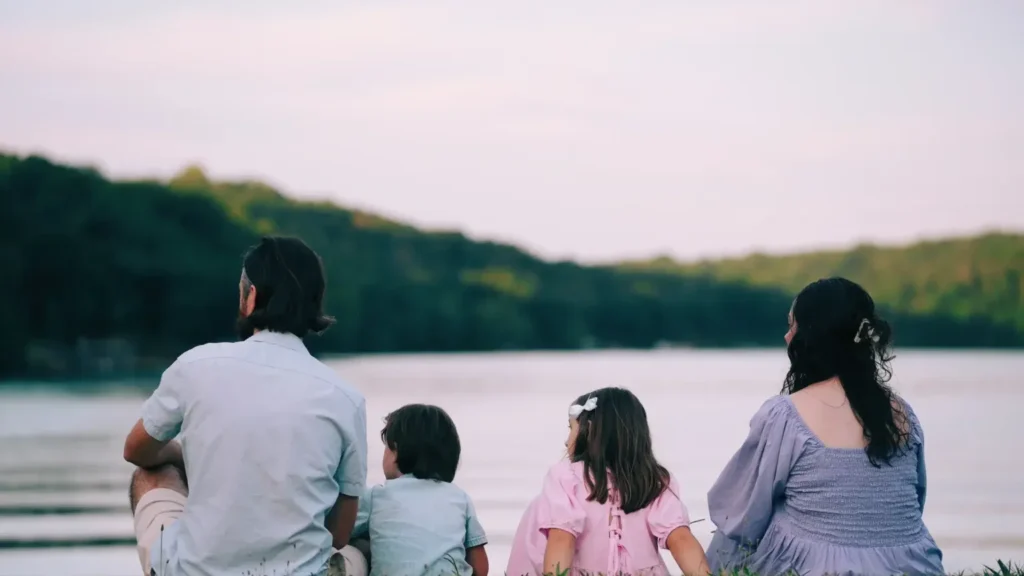 family looking at a lake